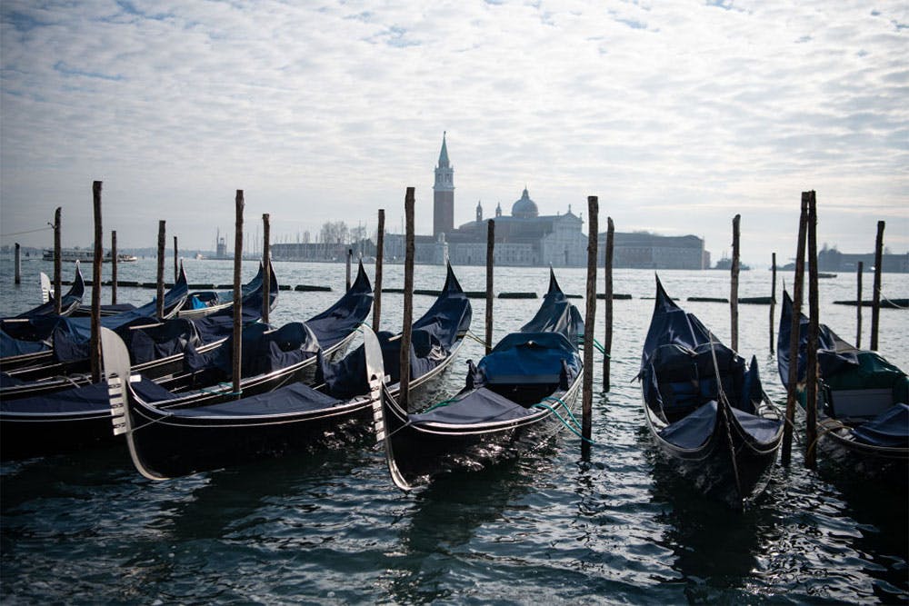In hibernation: covered gondolas line the shore in Venice in December 2020. Photo: Laurel Chor/Getty Images