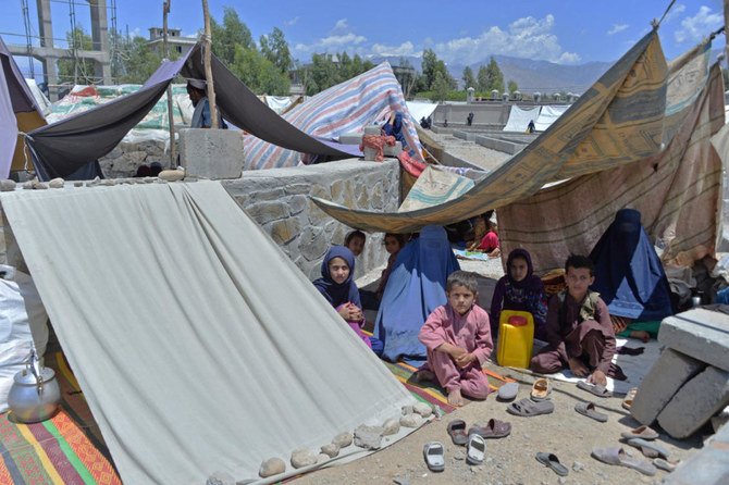 Afghan families who have been displaced due to fighting between Taliban and Afghan forces, take temporary shelter at a market in Mihtarlam, the capital of Laghman Province.(File/AFP)