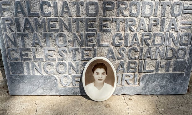 A picture of Lucia Mantione by her tombstone in Montedoro’s cemetery. Photograph: Lorenzo Tondo/The Guardian