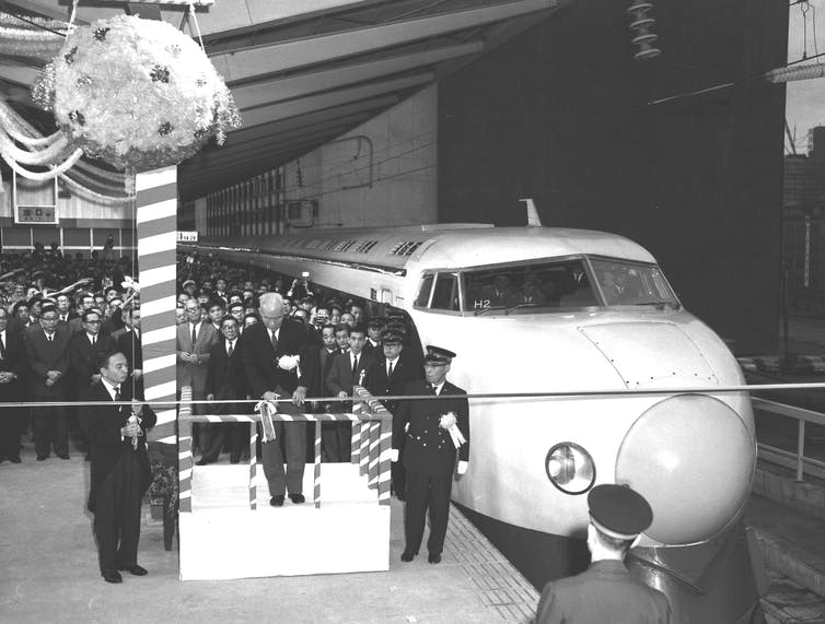 The grand opening of the Shinkansen bullet train at Tokyo in October 1964. Newscom/Alamy