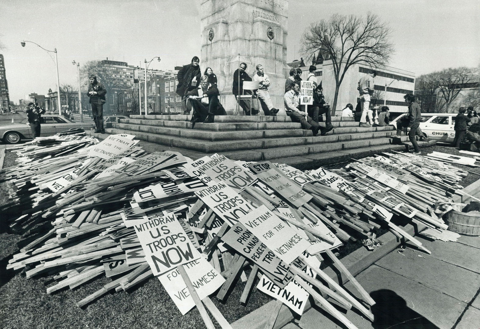 Title: Anti-Vietnam War placards surround Toronto’s war memorial in 1969. Photographer: Reg. Innell Date: April 6, 1969