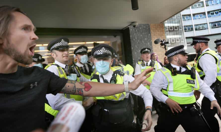 Police officers try to stop protesters from accessing the Studioworks site in west London. Photograph: Martin Pope/SOPA Images/Rex/Shutterstock