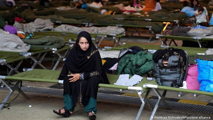 An Afghan girl sits in the transit area at the US Ramstein Air Base in Germany