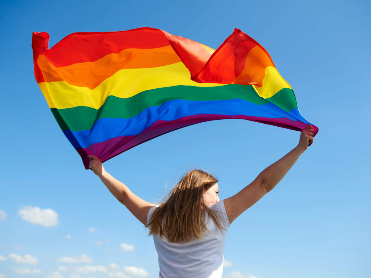 Woman holding Rainbow Flag