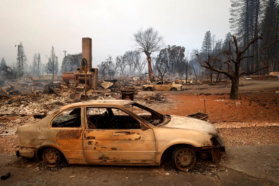 View of a burned car at the Dixie Fire, a wildfire that tore through the town of Greenville, California, U.S. August 5, 2021. REUTERS/Fred Greaves