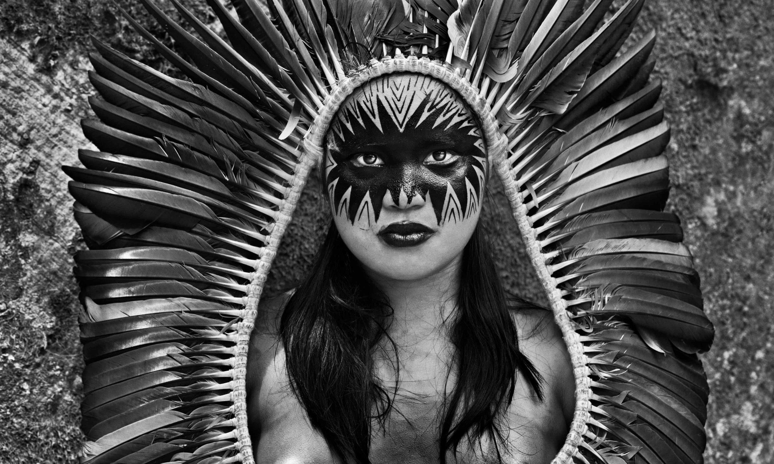 Bela Yawanawá, from the village of Mutum, with a headdress and painted face. Rio Gregório indigenous territory, Acre, Brazil, 2016. Photograph: © Sebastiao Salgado/nbpictures.com
