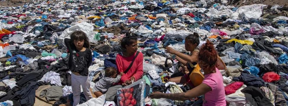 Women search for used clothes amid tons discarded in the Atacama desert, in Alto Hospicio, Iquique, Chile, on Sept 26, 2021. Read more at https://www.todayonline.com/world/chiles-desert-dumping-ground-fast-fashion-leftovers