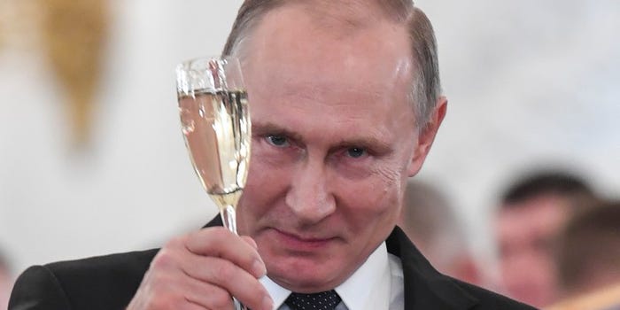 Russian President Vladimir Putin toasts with attendees after a state awards ceremony for military personnel who served in Syria, at the Kremlin in Moscow Thomson Reuters