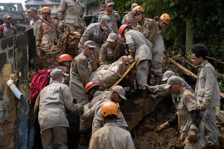 Extremely heavy rains set off mudslides and floods in a mountainous region of Rio de Janeiro state, killing dozens [File: Silvia Izquierdo/AP Photo]
