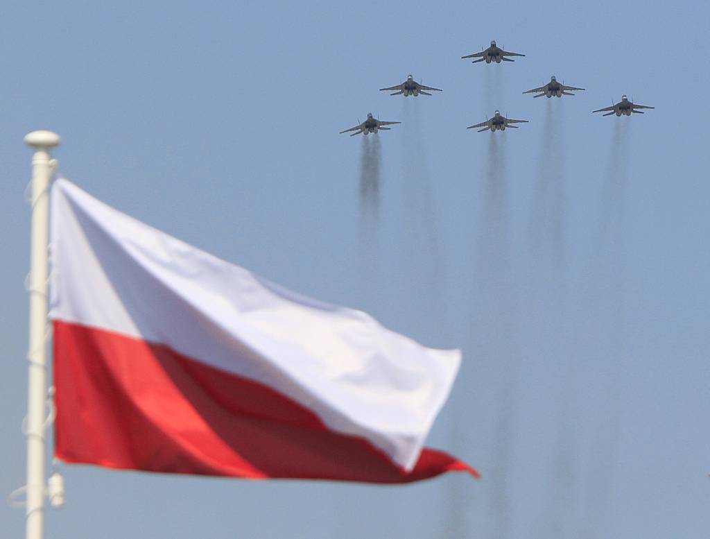 Polish Air Force Mig-29 aircrafts perform during a military parade celebrating the Polish Army Day in Warsaw, Poland on Aug. 15, 2015. (Czarek Sokolowski/AP)