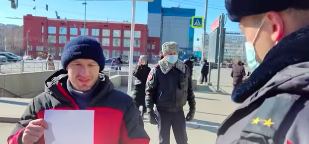 Watch: Russian police arrest protester for holding up blank sheet of paper