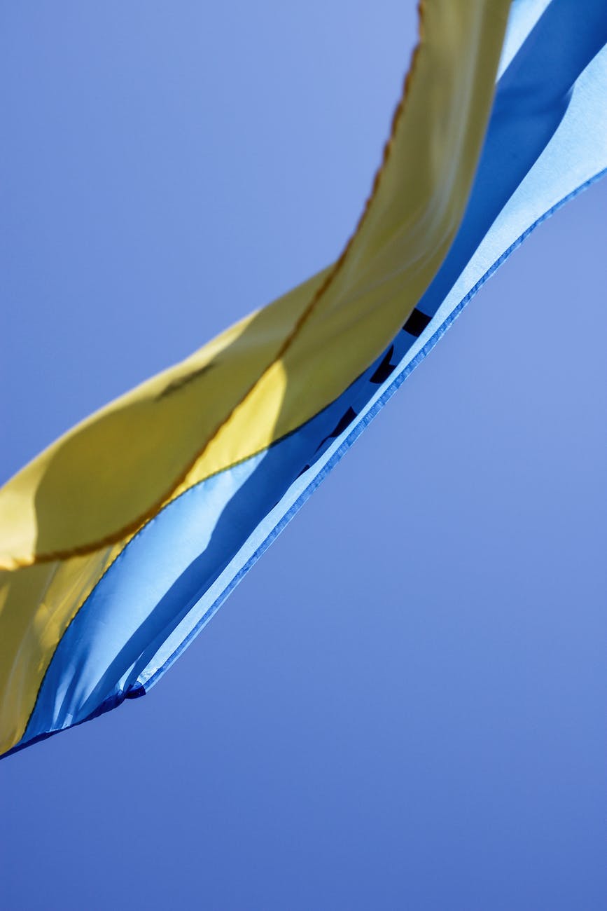 ukrainian flag waving in wind with clear sky in background