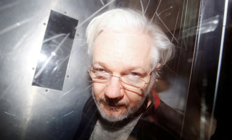 Julian Assange leaving Court in UK